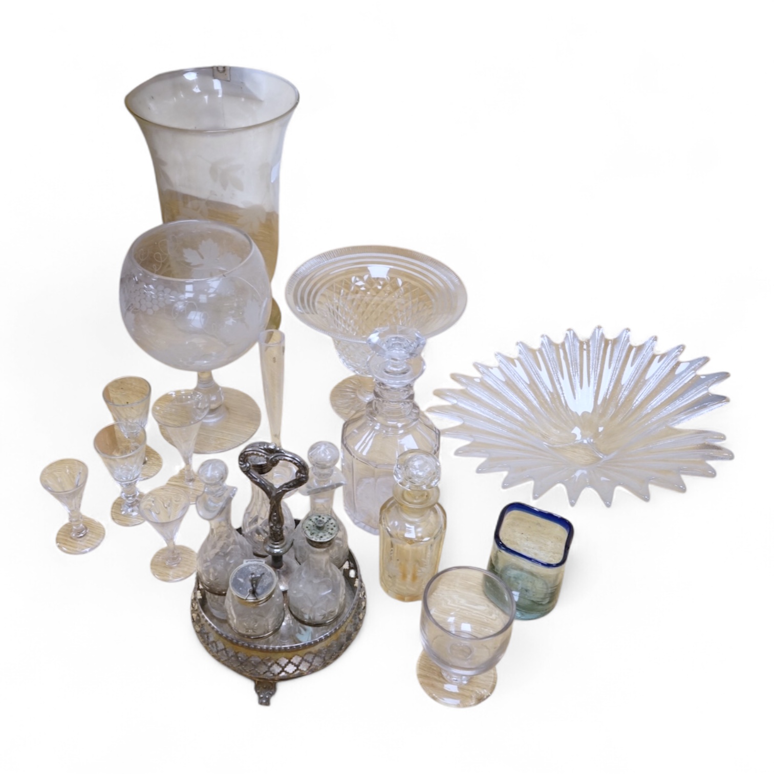 A collection of mixed glassware including two large engraved pedestal vases, a similar cut glass vase, a plated and cut glass cruet a Dartington mid century dish etc. tallest 35cm.